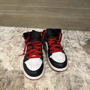 Black and White Jordan Sneakers with Red Accents